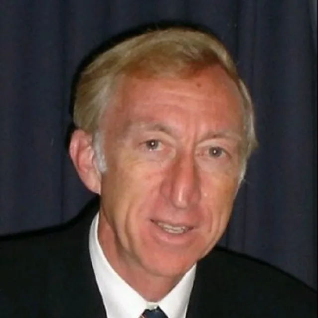 Portrait of Dr David Hemery CBE DL, whose coaching approach influenced David B. Jones's use and later adaptation of the GROW coaching model.